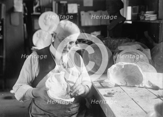 U.S.J. Dunbar with Death Mask of Admiral Dewey, 1917. Creator: Harris & Ewing.