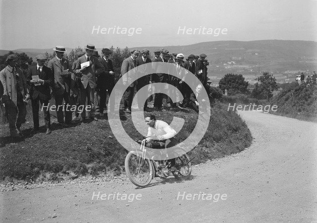 Motorcycle competing in the South Wales Auto Club Caerphilly Hillclimb, Wales, pre 1915.   Artist: Bill Brunell.