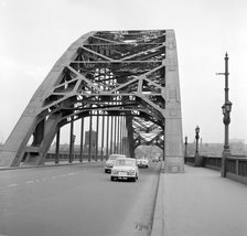 Mini on the 1959 Mobil Economy Run, Tyne Bridge in Newcastle. Creator: Unknown.