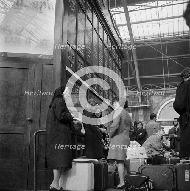 Passengers at Victoria Station, London, 1960-1972. Artist: John Gay