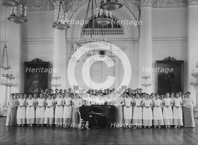 Pupils of the Smolny Institute for Noble Maidens at a Music Lesson, c. 1913. Artist: Bulla, Karl Karlovich (1853-1929)