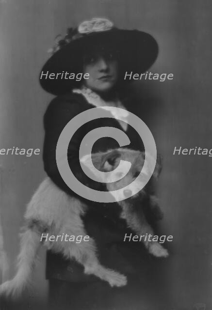 Taylor, Laurette, Miss, with dog, portrait photograph, 1913. Creator: Arnold Genthe.