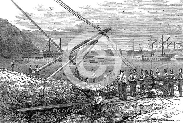 Landing guns at Munden's Cove, 1874.  Creator: Unknown.