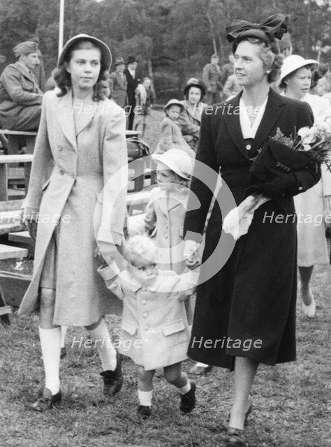 Crown Prince Carl Gustav with mother Sibylla and big sister Margaretha, Stockholm, 1947. 
 Creator: Unknown.