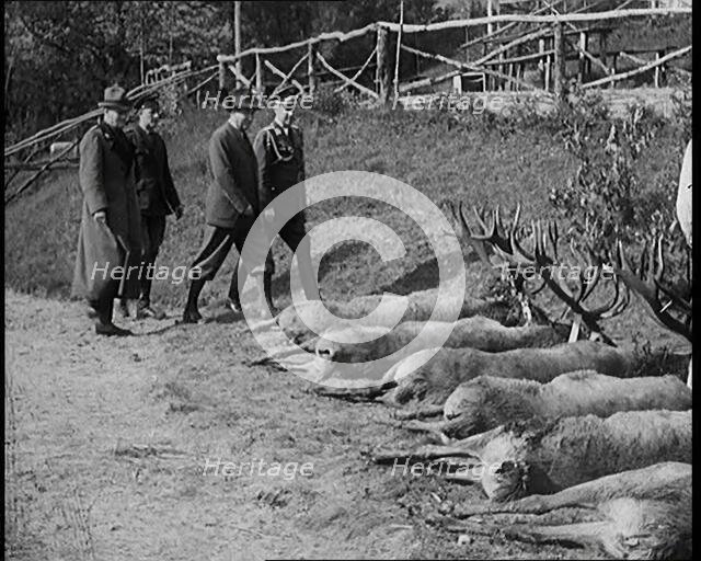 Nazi Officer Hermann Goering in Hunting Dress Showing His Colleagues a Line of Deer He Has..., 1931. Creator: British Pathe Ltd.
