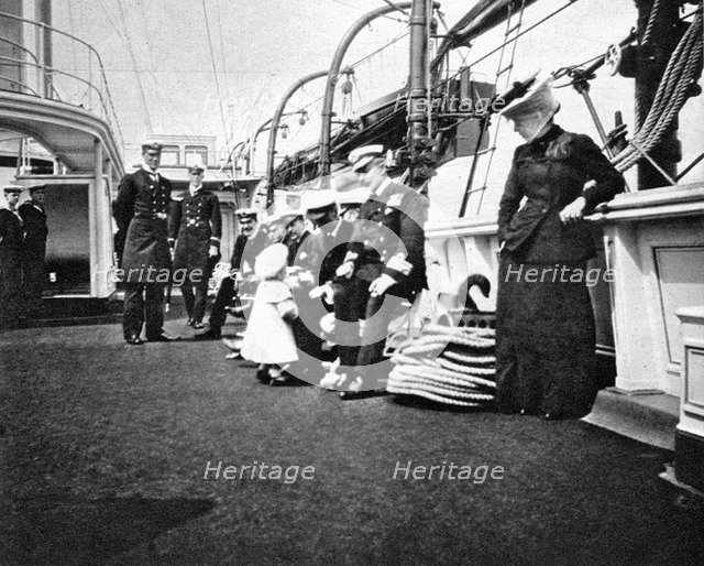 Prince Olav (1903-1991), the future King Olav V of Norway, conversing with naval officers, 1908.Artist: Queen Alexandra