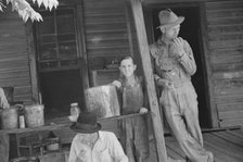 Bud Fields, Tengle boy, and Floyd Burroughs on Frank Tengle's porch, Hale County, Alabama, 1936. Creator: Walker Evans.