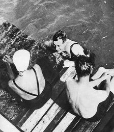 The Prince of Wales with friends on a raft, the Riviera, c1930s. Artist: Unknown