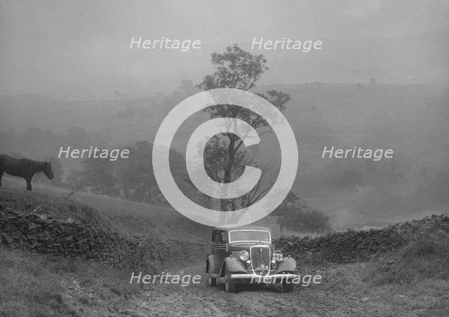 Ford V8 saloon of AKB Clarkson competing in the MCC Sporting Trial, 1935. Artist: Bill Brunell.