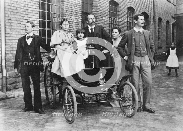 Carl Benz with his family at his Benz Velo in the Mannheim factory yard, 1894. Creator: Anonymous.
