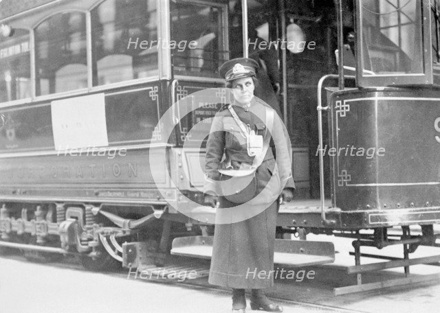 A tram conductor in her winter uniform, possibly in Glasgow, 1915. Artist: Unknown