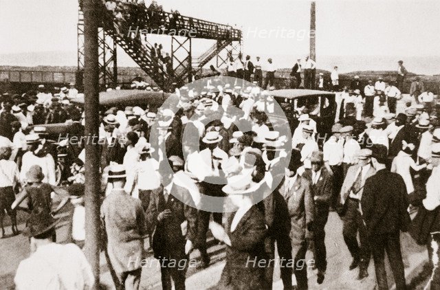 African Americans and whites leaving the beach as trouble begins, Chicago, Illinois, USA, c1919. Artist: Unknown