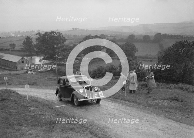 Standard 12 saloon of Miss I Webber competing in the South Wales Auto Club Welsh Rally, 1937 Artist: Bill Brunell.