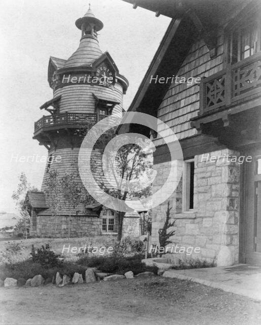 Windmill-shaped clock tower at left, and part of garage of Edmund..., Greenwich, Connecticut, 1908. Creator: Frances Benjamin Johnston.