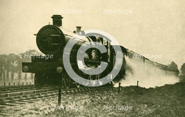 'Birmingham Express Picking Up Water at Ruislip, Great Western Railway', 1930. Creator: F. E Mackay.