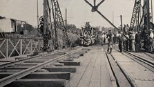 Zimbabwe: people and a flag-covered train at the opening of Victoria Bridge, 1905. Creator: J Lomas.