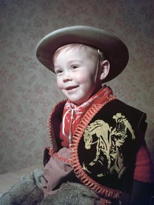 Young boy in a cowboy outfit, c1955.  Creator: Arthur Charles Kirby Ware.