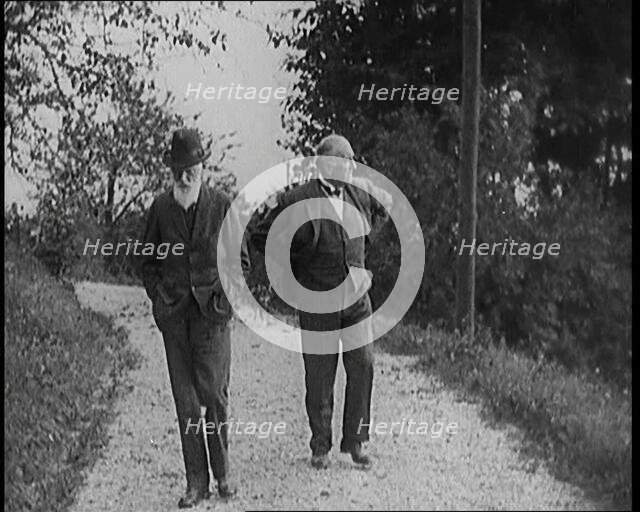 George Bernard Shaw Walking Down a Country Lane With a Male Civilian, 1920s. Creator: British Pathe Ltd.