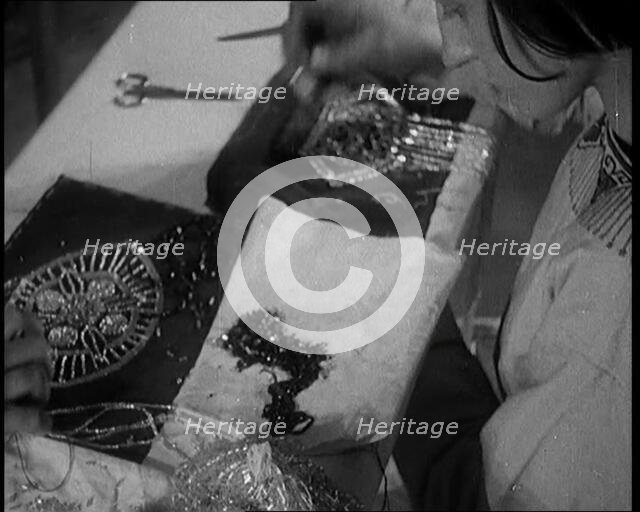 Young Female Civilian Embroidering a Piece of Fabric in an Arts Class, 1920. Creator: British Pathe Ltd.