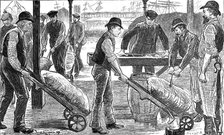 Dockers unloading sugar at West India Docks, London, 1889. Artist: Unknown