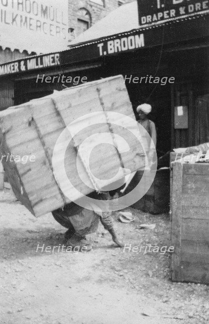 A porter lifting a large load, Chakrata, India, 1917. Artist: Unknown