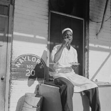 Washington, DC. A dishwasher who works in a waterfront restaurant, Washington, D.C., 1942. Creator: Gordon Parks.