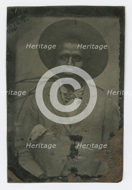Tintype portrait of a man wearing a hat and suit, late 19th century. Creator: Unknown.