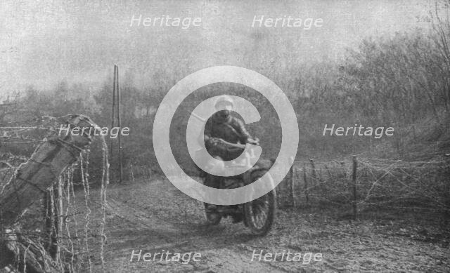 'A Travers la Fournaise; Un autre de ceux qui ont eu a coeur de remplir grandement..., 1916 (1924) Creator: Unknown.