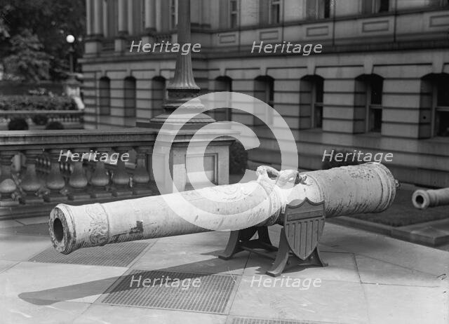Medals, Decorations, Etc. - Spanish Gun at War Department Made Into Medals, 1917. Creator: Harris & Ewing.