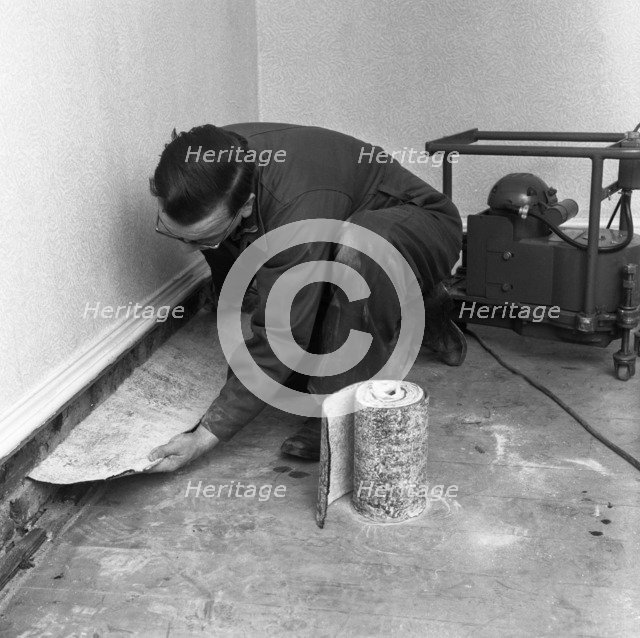 Installing a damp proof course in a house in Goldthorpe, South Yorkshire, 1957.  Artist: Michael Walters