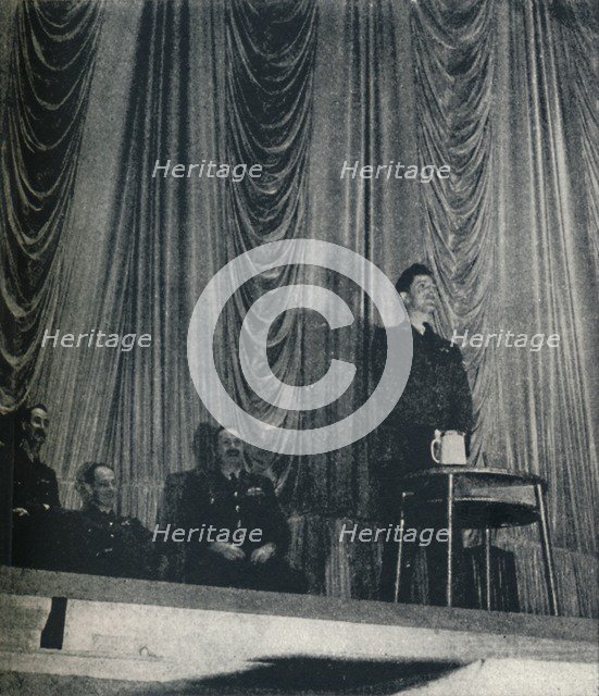 'Flight Lt. J. Nicholson, V.C., stresses the importance of discipline to Cadets', 1941. Artist: Cecil Beaton.