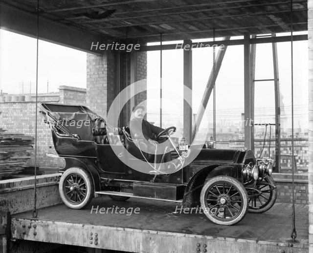 Car lift at Mitchell Motors Company, 114 Wardour Street, Westminster, London, 1907. Artist: Bedford Lemere and Company.
