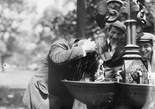 Cooling his head - N.Y. on hot day, between c1910 and c1915. Creator: Bain News Service.