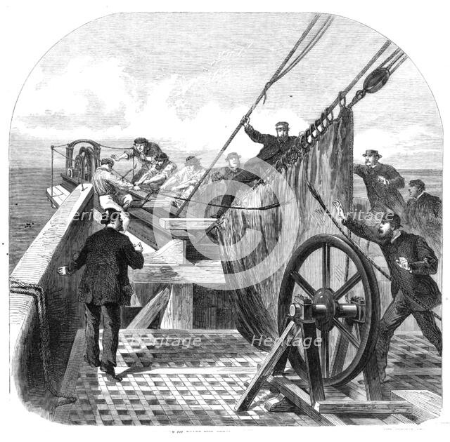 The breaking of the Atlantic Telegraph Cable on board the Great Eastern, 1865. Creator: Unknown.