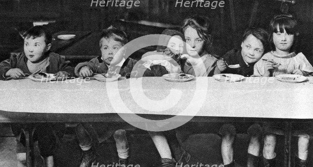 East End children being fed by a charitable organisation, London, 1926-1927. Artist: Unknown