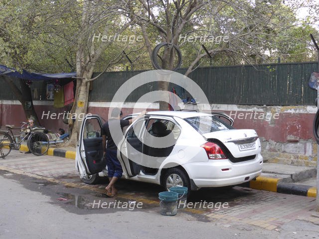 Car washing in Delhi. Creator: Unknown.
