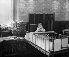 Child in the Hospital for Sick Children, Great Ormond Street, London, 1893. Artist: Bedford Lemere and Company.