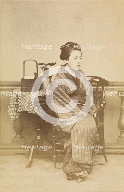 Woman sitting by table, about 1868. Creator: Felice Beato.