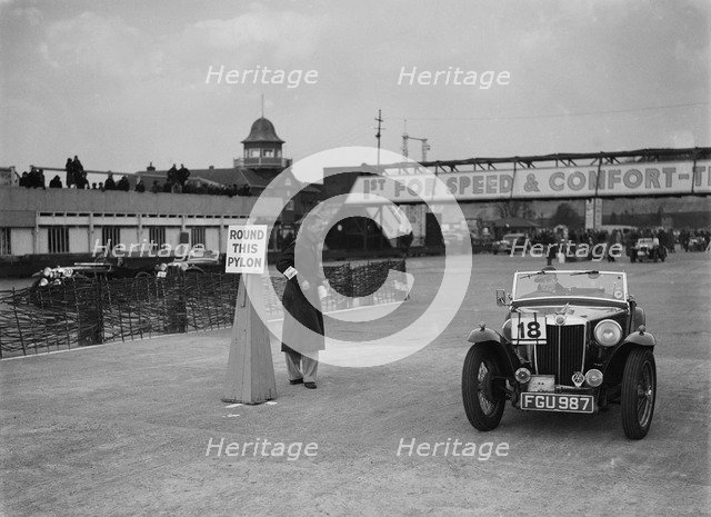 MG TA competing in the JCC Rally, Brooklands, Surrey, 1939. Artist: Bill Brunell.