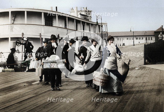 Immigrants to the USA landing at Ellis Island, New York, c1900. Artist: Unknown.