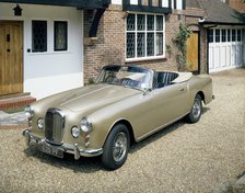 A 1963 Alvis car parked on a gravel driveway. Artist: Unknown