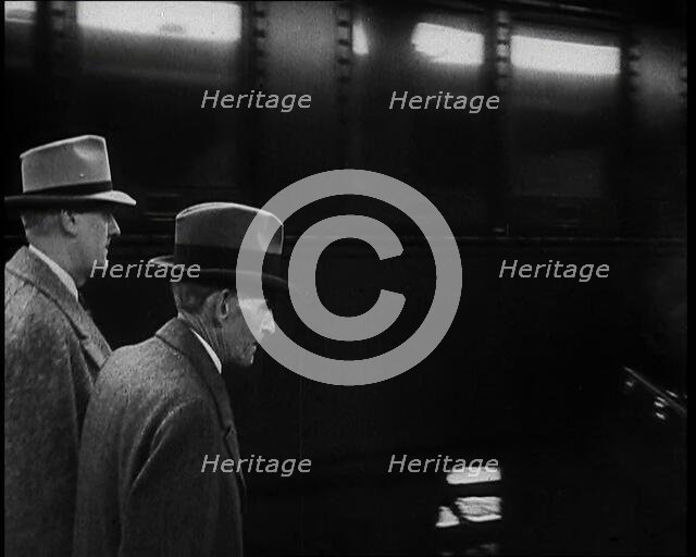 Henry Ford Walking Along a Train Station Platform, 1930s. Creator: British Pathe Ltd.