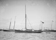 The yawl 'Beluga' at anchor, 1911. Creator: Kirk & Sons of Cowes.
