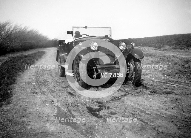 Kitty Brunell road testing a Riley 9 tourer, c1930.  Artist: Bill Brunell.