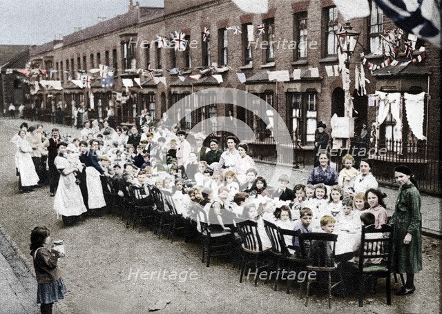 ' A children's tea party in an East End Street in London, to celebrate the Treaty of Versailles at t Artist: Unknown.