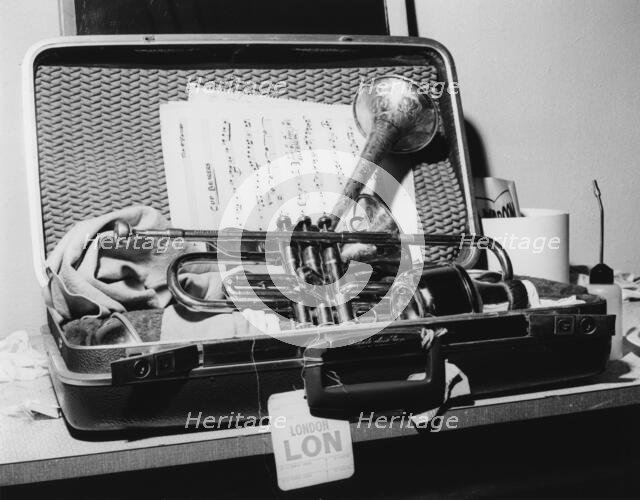 Dizzy Gillespie, trumpet in case, Manchester, 1963. Creator: Brian Foskett.