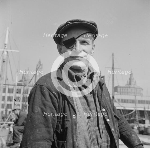 Dock stevedore at the Fulton fish market, New York, 1943. Creator: Gordon Parks.