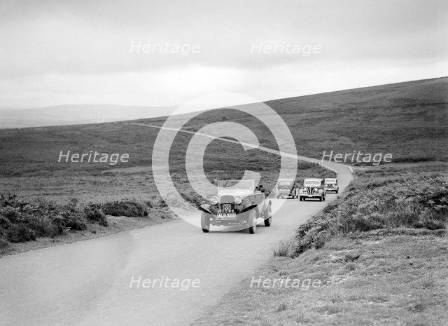 Ford V8s of WCN Norton and J Harrison competing at the MCC Torquay Rally, July 1937. Artist: Bill Brunell.