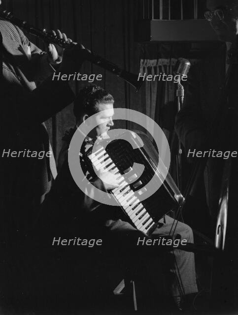 Portrait of Joe Mooney and Andy Fitzgerald, Eddie Condon's, New York, N.Y., ca. June 1947. Creator: William Paul Gottlieb.