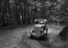 Singer Nine saloon competing in the B&HMC Brighton-Beer Trial, Fingle Bridge Hill, Devon, 1934. Artist: Bill Brunell.